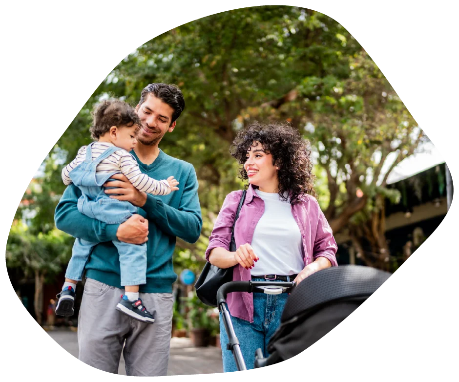 Parent and child walking outdoors together, smiling