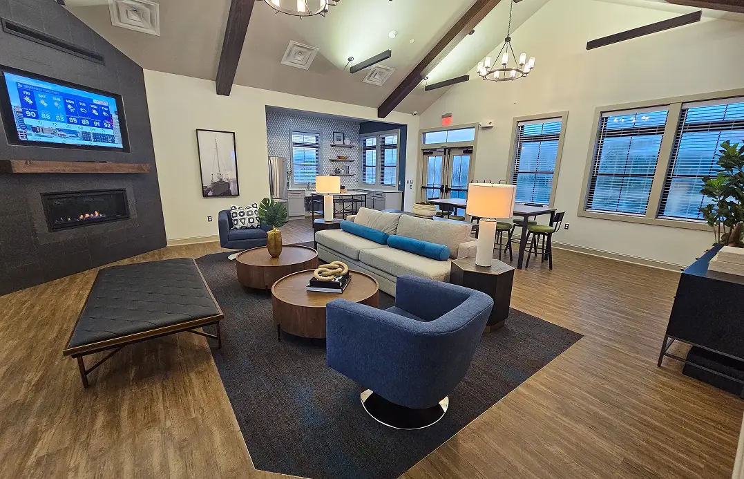 Blue accent chairs and large windows